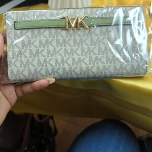 Michael Kors Cream Signature Wallet with Green Trim and Gold MK Hardware